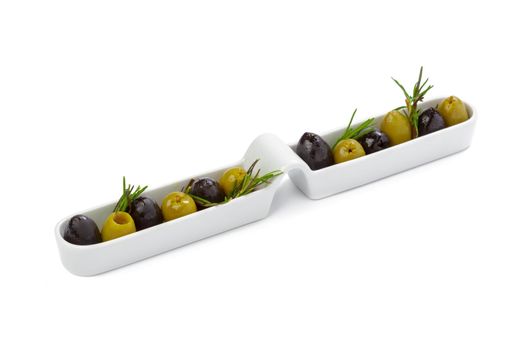 Black and green olives served in white plate isolated on white background