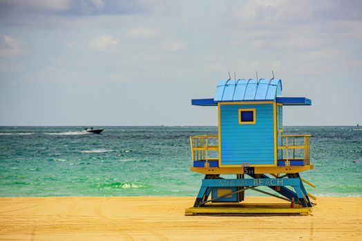 Miami South Beach lifeguard tower and coastline with cloud and blue sky. Miami Beach, Florida