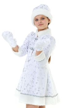 Portrait of girl dressed as Snow Maiden. Adorable happy girl in white hat, fur coat embroidered with silver threads and mittens doing welcome gesture. Winter holidays celebration concept