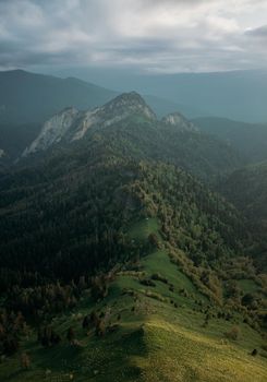 Mountain ridge with rocky peak in summer.