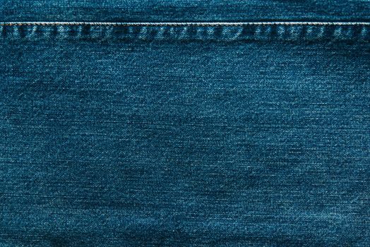 Cloth blue jeans denim texture background, closeup.