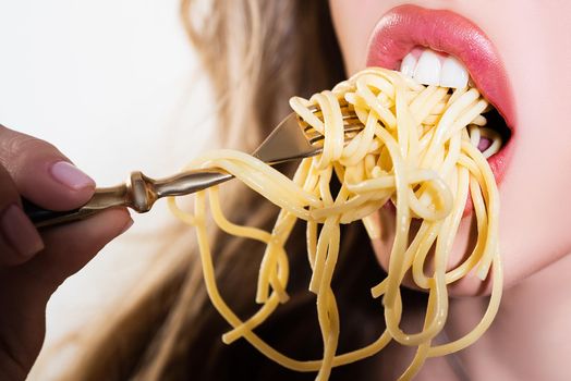 Sensual lips, open mouth close up. Girl eats a pasta spaghetti