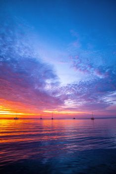 Sunset sea beach. Blue sea and reflection of sunlight