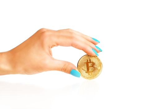 Bitcoin - symbol of virtual money in a female hand on a white background.