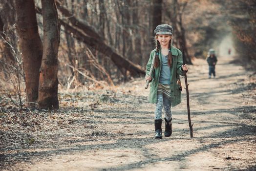 little girl goes through the woods, photo in vintage stylev