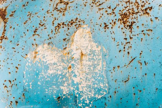 Old scratched and rusty metallic surface of blue color, texture.
