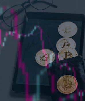 Double exposure of infographics with image of gold bitcoins on wallet and digital tablet near the glasses.