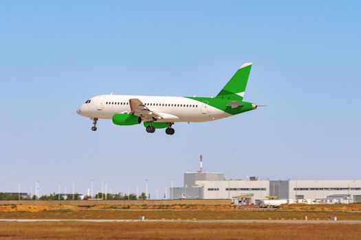 Passenger plane taking off from runway at airport on sunny day photo