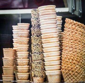 stack of empty waffle ice cream cones of different kind