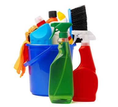 Liquid detergents and cleaning supplies in plastic bucket on white background, close up
