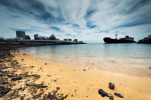 old broken ship agrounded near Lanzarote seashore, Canary Islands, Spain