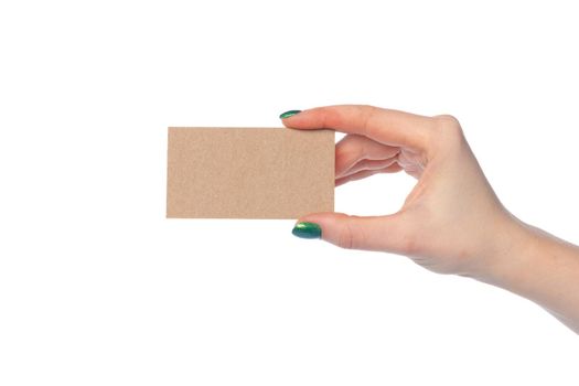 Craft paper card in female hand isolated on white background