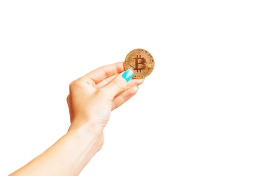 One gold coin bitcoin in a female hand isolated on a white background.