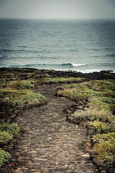 beautiful stone path to the sea horizone
