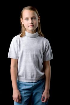 Close up view of a cute smiling girl, charming baby, wearing stylish clothes, posing in studio, portrait of a lovely happy girl, isolated on black background