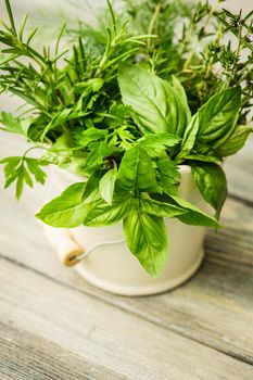 Fresh herbs outdoor on the wooden table