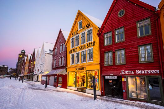 Bergen, Norway - December 27, 2014: Famous Bryggen street with wooden colored houses in Bergen at Christmas, Norway