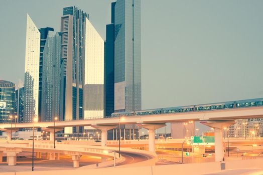 Skyscraper roads and bridge at the Sheikh Zayed Road in Dubai in the evening, United Arab Emirates