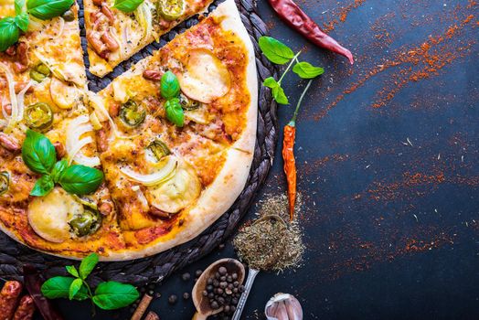 tasty pizza on a dark table