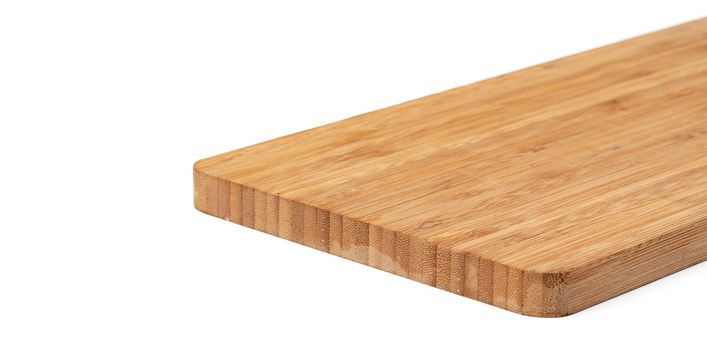 Wooden cutting board on a white background, close up