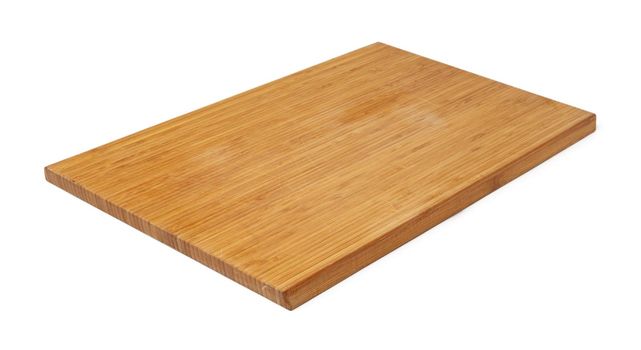 Wooden cutting board on a white background, close up