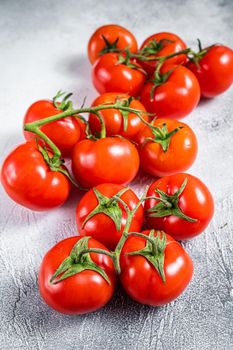 Fresh red tomatoes on kitchen table. White background. Top view.