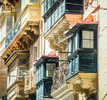 old ruined balcony in a street of historical center of Valletta in Malta