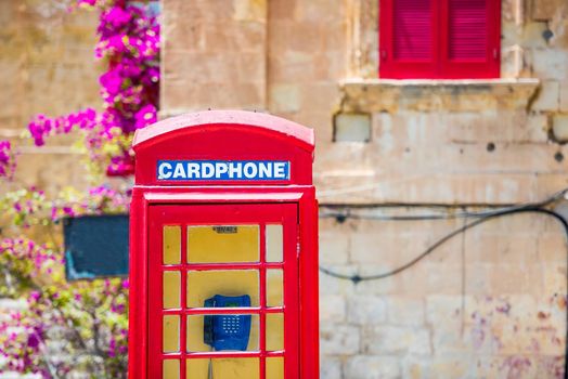 red cardphone in a steet of Valletta in Malta