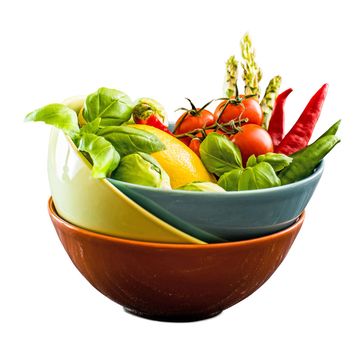 Fresh vegetables in a bowl isolated on a white background