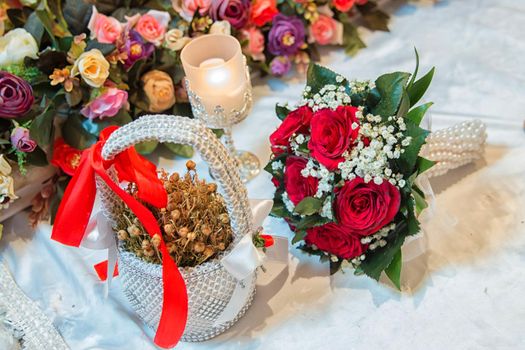 Uzerik Grass . in the basket . Red wedding bouquet of flowers