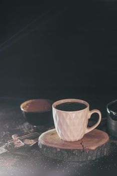 Cup of hot chocolate on dark background.