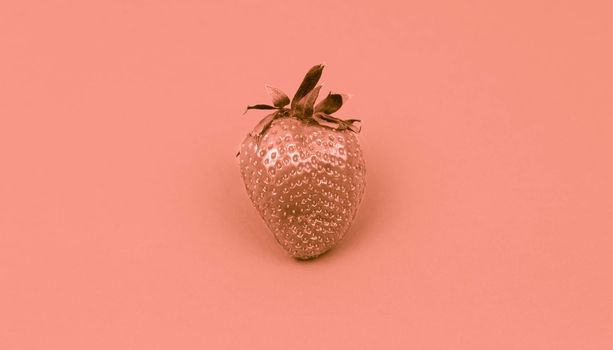 Rose gold Painted fruit strawberry on a color rose background