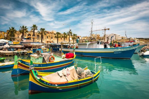 Marsaxlokk, Malta - 24 May 2015: fishing boats near fishing village of Marsaxlokk (Marsascala) in Malta