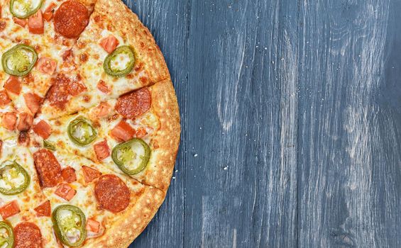 pizza close-up on a wooden surface