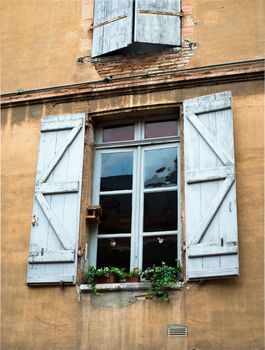 old vintage window in a brick wall