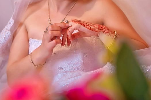 Closeup wedding rings on the hands . The bride wears a ring on her own hands