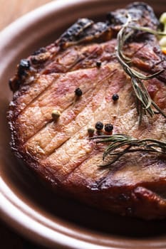 Meat steak roasted on grill with spices on the plate