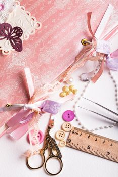 making scrapbooking album with rings and decorations on the table and tools