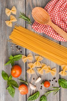 Raw Italian pasta with tomato sauce ingredients