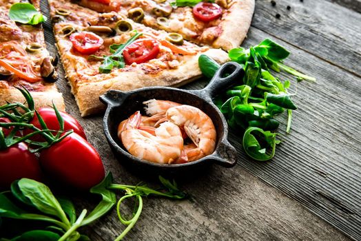 Delicious seafood pizza on a wooden textured table
