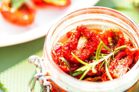 sun dried tomatoes in a glass jar