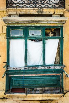 retro old green balcony in historical center of Valletta in Malta