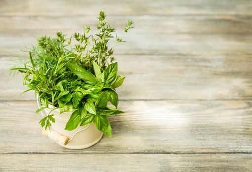 Fresh herbs outdoor on the wooden table