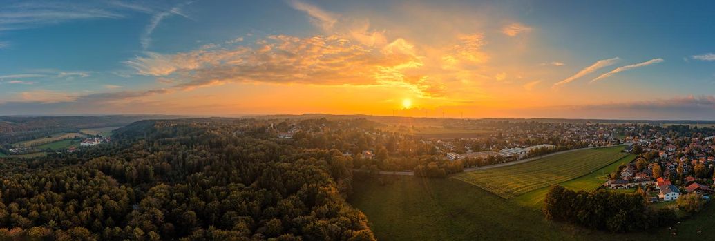 Sunset view over the beautiful landscape in southern bavaria with the monastery of Schaeftlarn