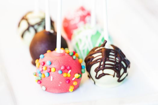 Cake pops close up on the white plate