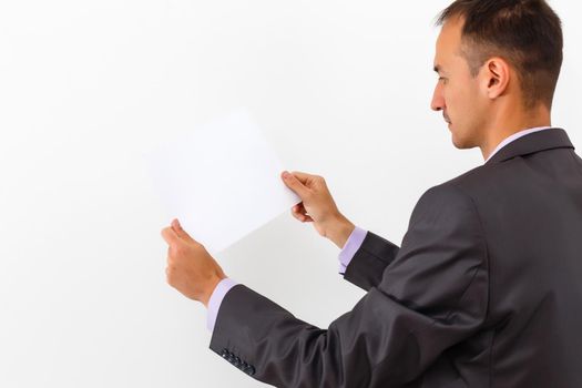 businessman holding a blank white board, signboard, showing an emty bill board against white background