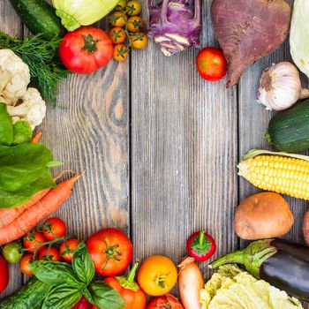 Various vegetables on a wooden table with copy space