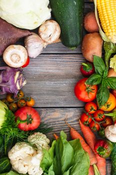 Various vegetables on a wooden table with copy space