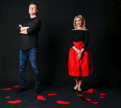 Guy and girl Valentine Valentine's background, Valentine's Day, on the floor of the heart of the married space. holiday formula. love, engagement in red girl dress, barefoot