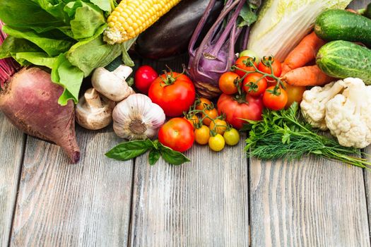 Various vegetables on a wooden table with copy space